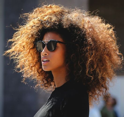 Le fashion blog model imaan hammam style curly hair inspiration round sunglasses black crop top street style beauty via refinery29